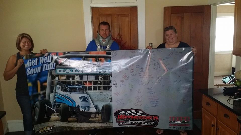 Tim Calicoat Tim Calicoat hold signed banner